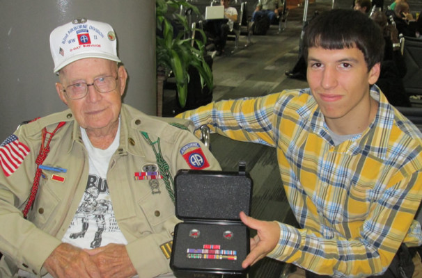  Nellis Ver Hey 82nd Airborne 508th PIR G Company with his Grandson Andrew Ver Hey receiving his ribbons at the Airport on our departure